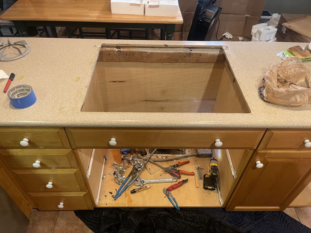 Gas cooktop with a downdraft vent — Process